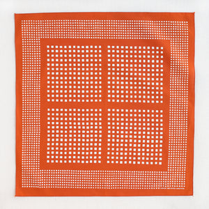 Marmalade orange bandana with a white square motif by Abracadana. Shown flat so the whole design is visible.
